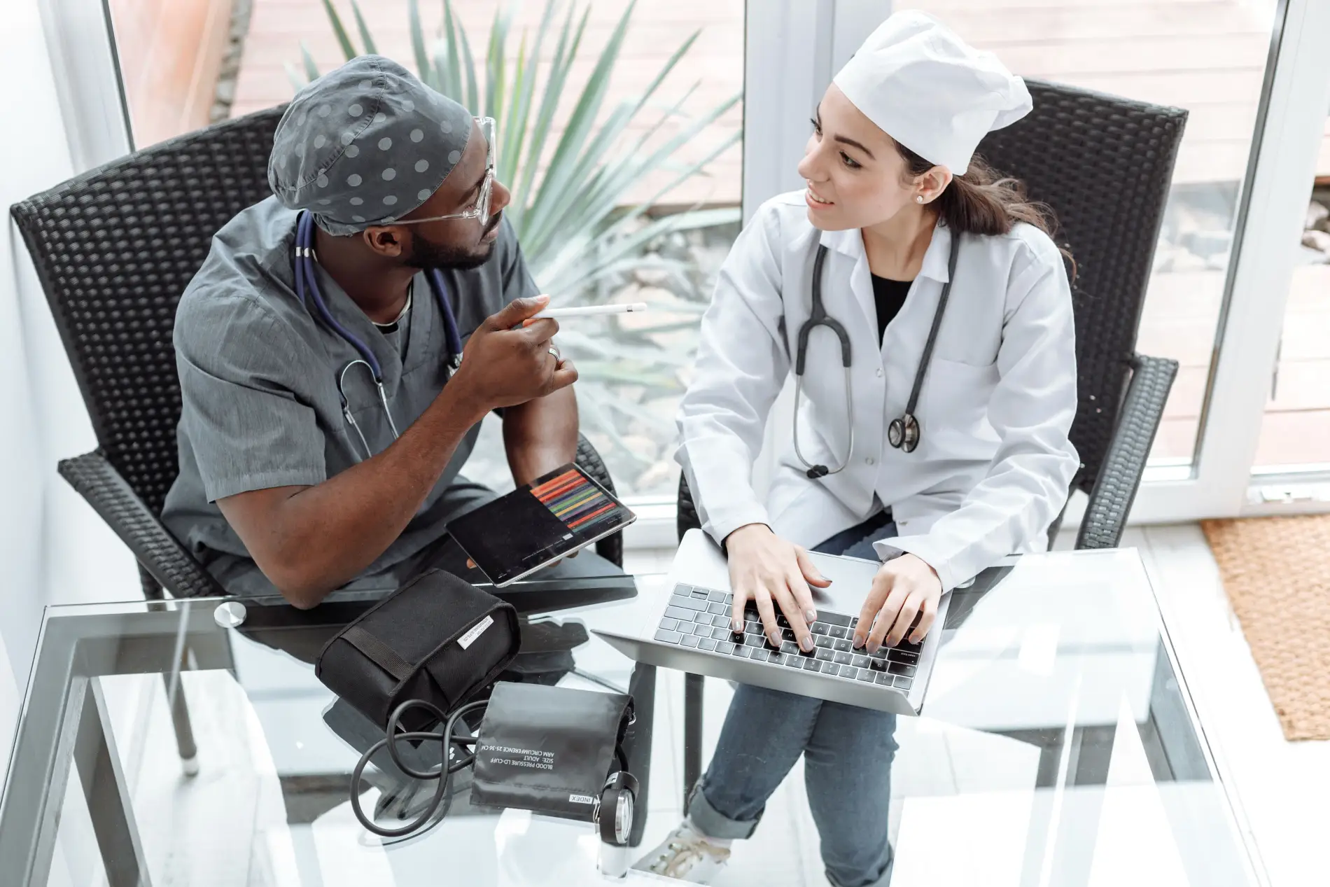 Senior physician and associate discussing an associate buy-in